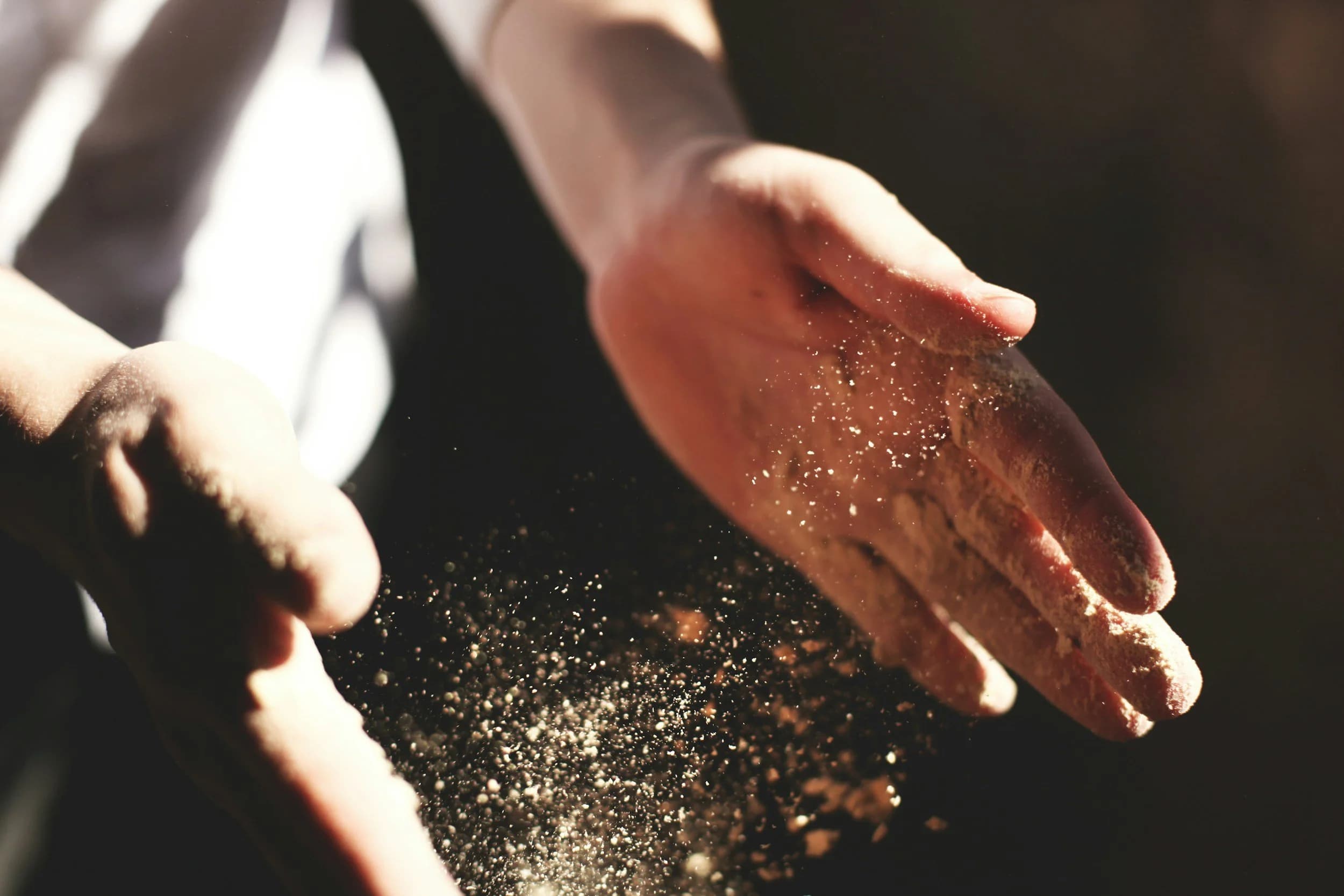 A craftsman's hands in warm light