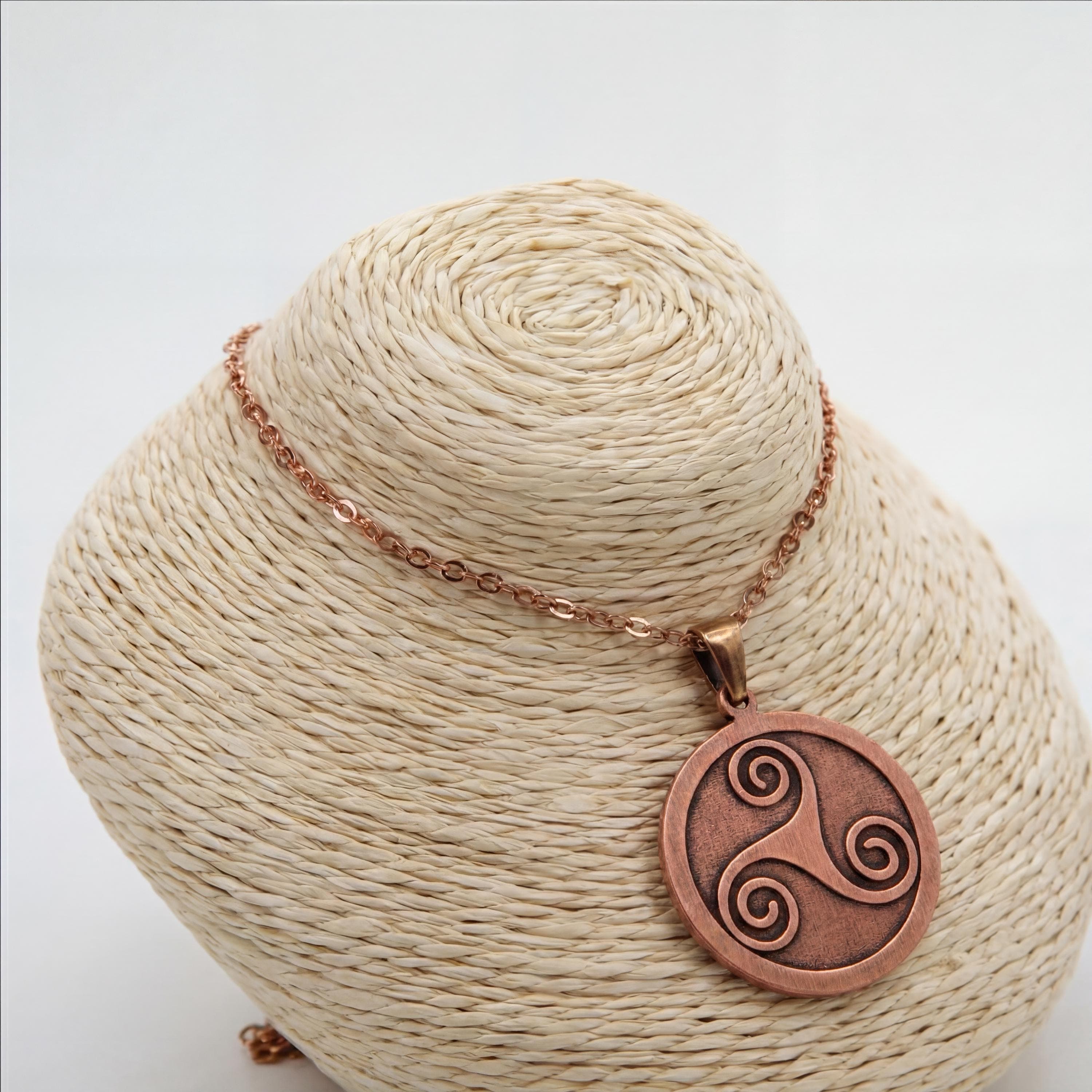 Engraved copper triskelion pendant